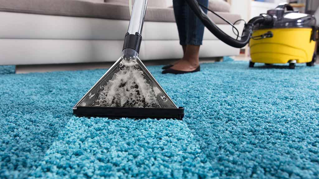 person-using-an-at-home-carpet-cleaner.jpg